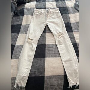 Cream skinny distressed jeans